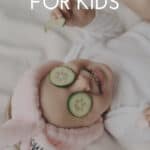 A Pinterest pin with an image of a young girl lying on a bed with a towel wrapped around her head and cucumber over her eyes. The text says, Spa Party for Kids