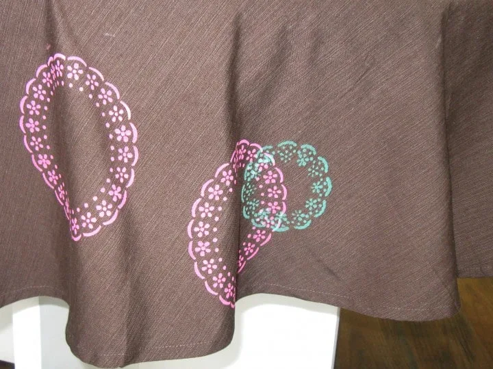 brown tablecloth stenciled with colorful lace circles using martha stewart stencils and fabric paint