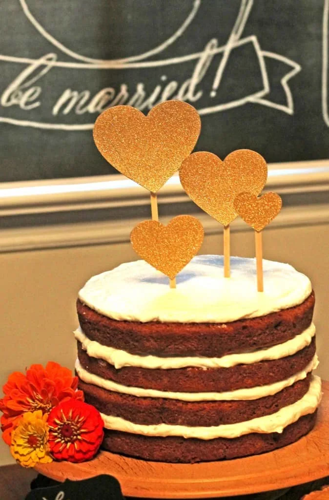 bridal shower cake with gold heart toppers