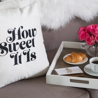 decorative throw pillow with words on sofa