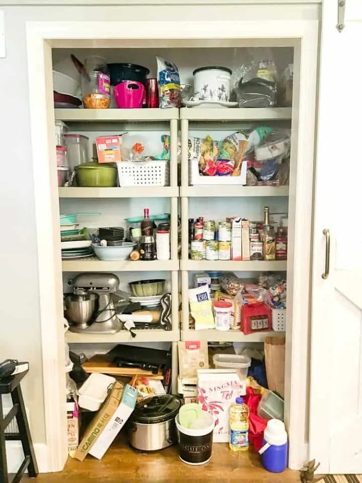 disorganized kitchen pantry shelves before a diy pantry project to organize and improve kitchen storage
