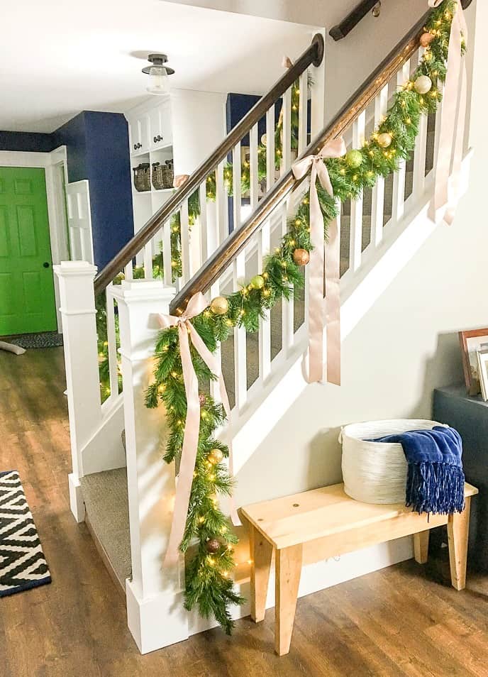 how to make faux evergreen staircase garland with LED lights