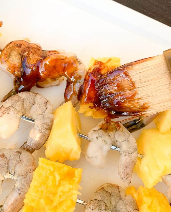 homemade teriyaki marinade brushed onto a shrimp and pineapple skewer