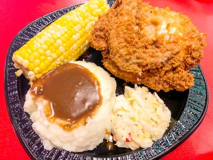 fried chicken platter with mashed potatoes corn and coleslaw at Universal Studios