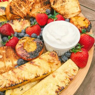 grilled pineapple and peaches with strawberries, blueberries and grilled pound cake
