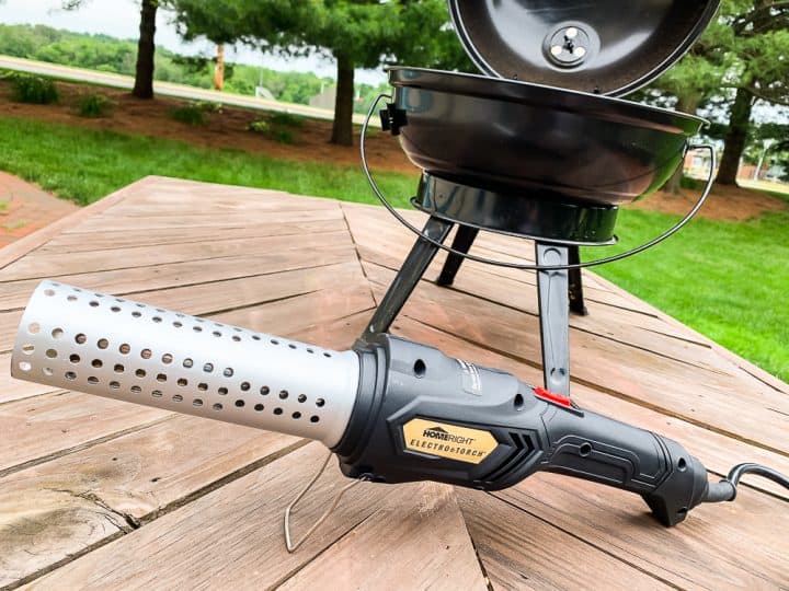 charcoal grill with HomeRight Electro Torch in front of it