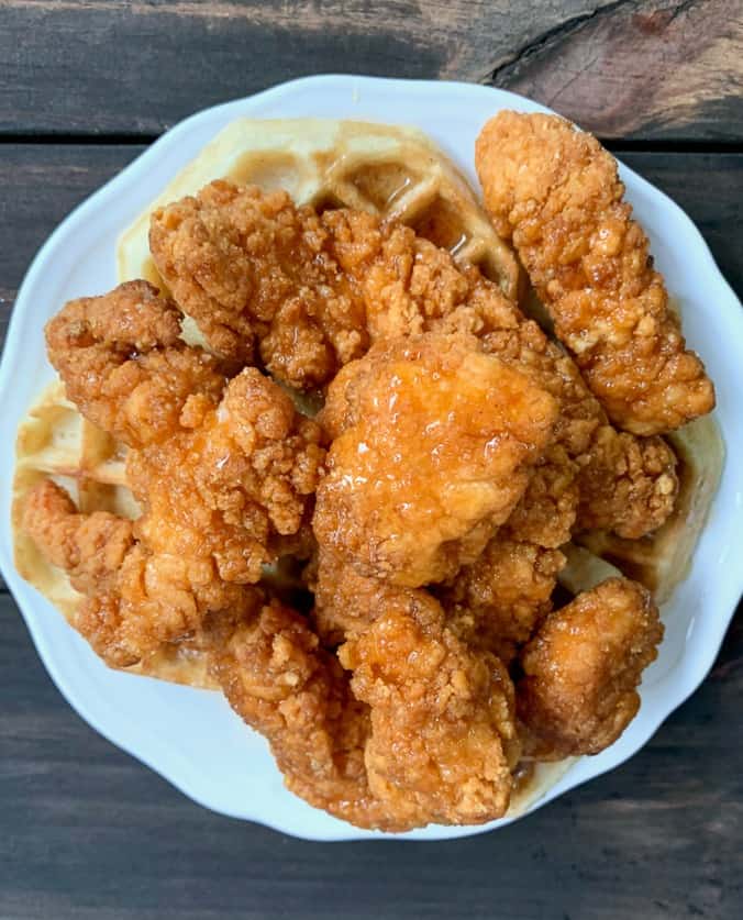 crispy chicken and waffles with honey and maple syrup