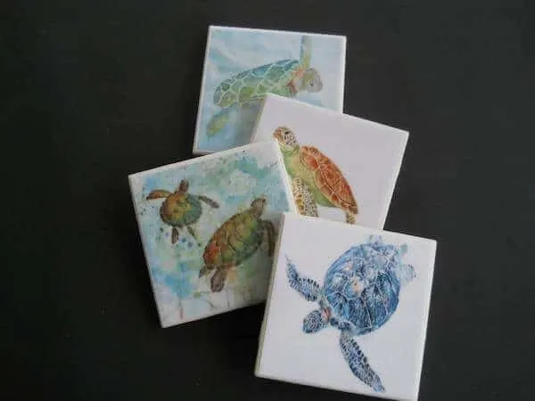 4 ceramic tile coasters with  watercolor turtles painted on each