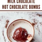 A Pinterest Pin with a photo of a milk chocolate hot chocolate bomb melting in a mug of milk. The text says, "Milk Chocolate hot Chocolate Bombs"