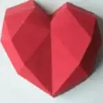 An edible chocolate heart box made from red candy melts. Fill with wrapped candies or chocolates for a Valentine's day gift.