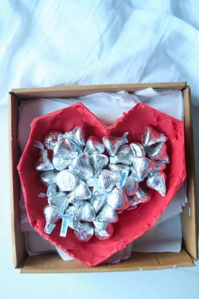 An edible chocolate heart box filled with wrapped Hershey's chocolate kisses.