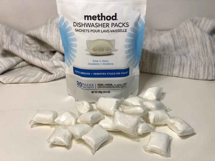 Method free and clean dishwasher detergent packs scattered on a white counter in front of their package
